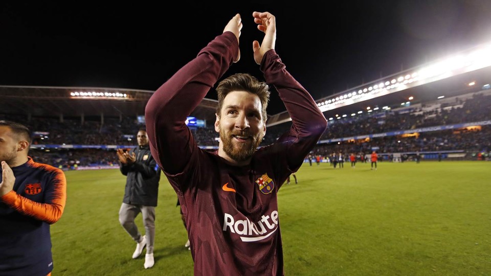 Lionel Messi celebrating his ninth league title with BarÃ§a
